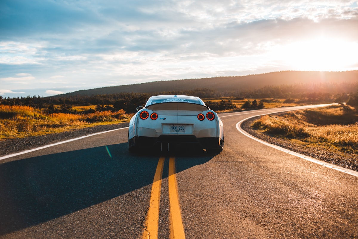 Car driving on an open road representing student driver freedom