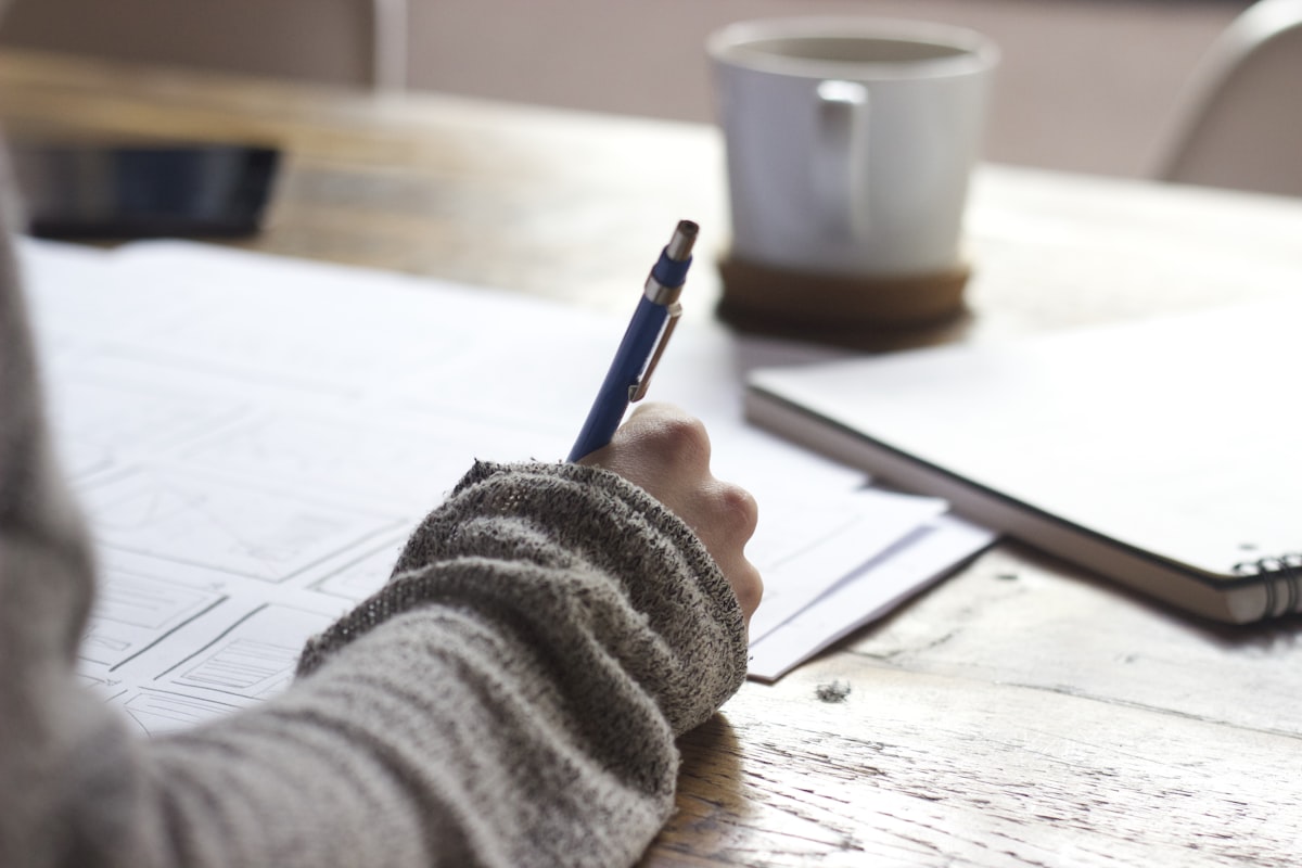 College student studying hard to maintain good GPA for insurance discount