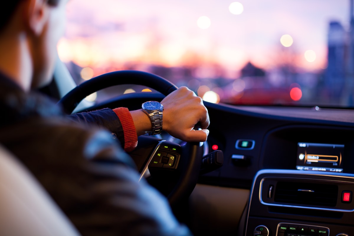 Focused young student driver on the road