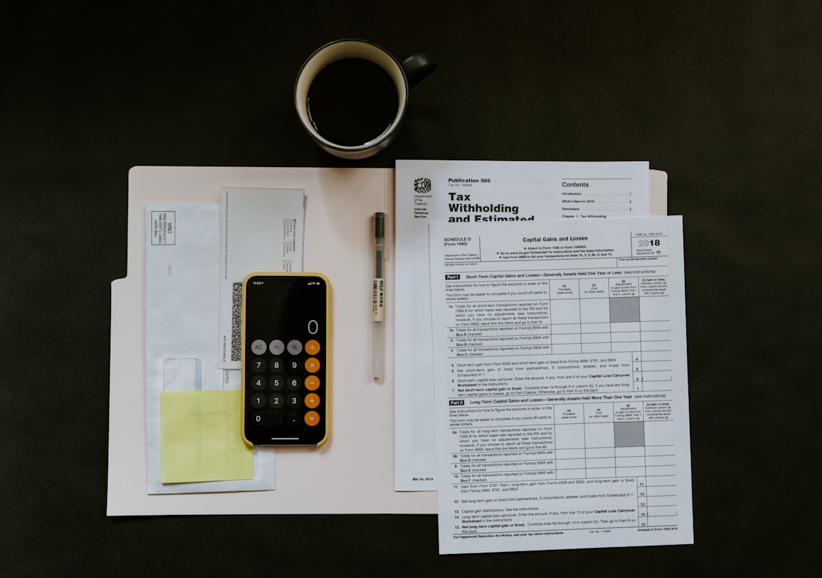 Person using calculator app on phone for insurance costs