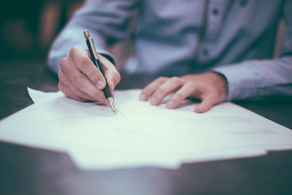 Documents and paperwork on a desk with passport