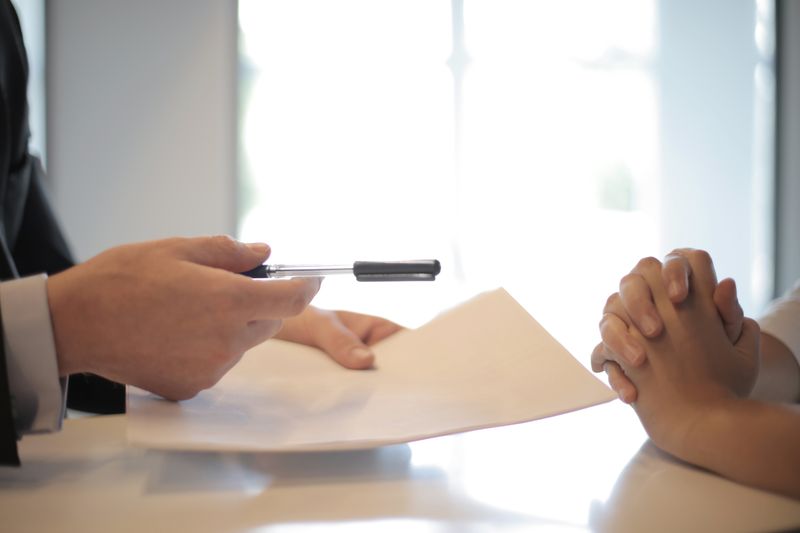 Public adjuster meeting with car owner to review claim documents