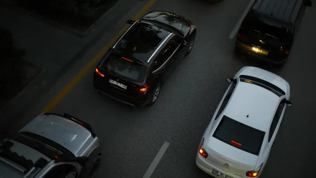 Driver navigating through busy city traffic