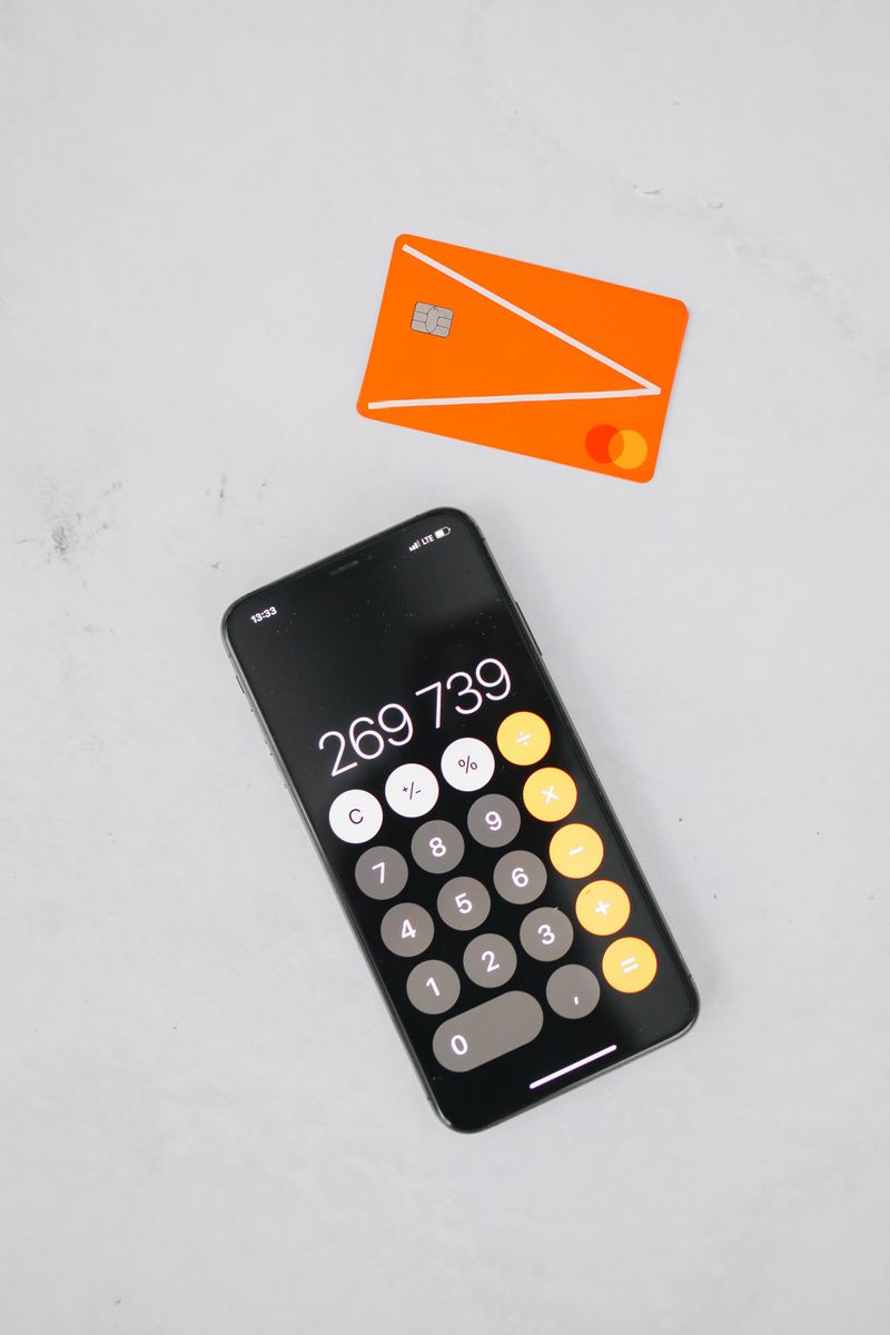 Person using calculator for financial planning