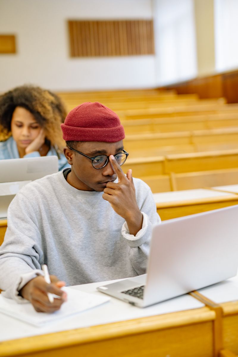 Student studying on laptop for good grades discount