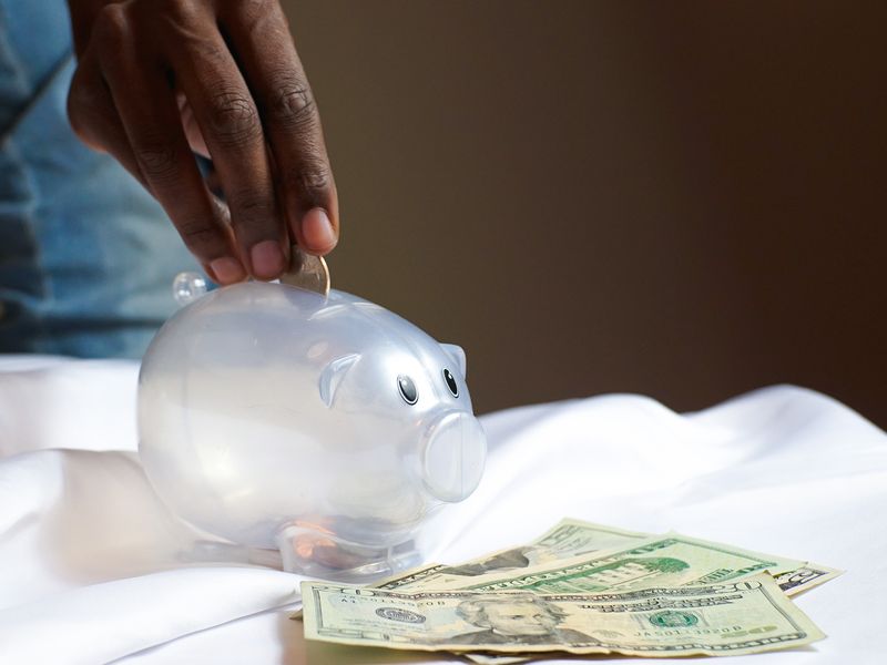 Student budgeting and saving money for first car purchase