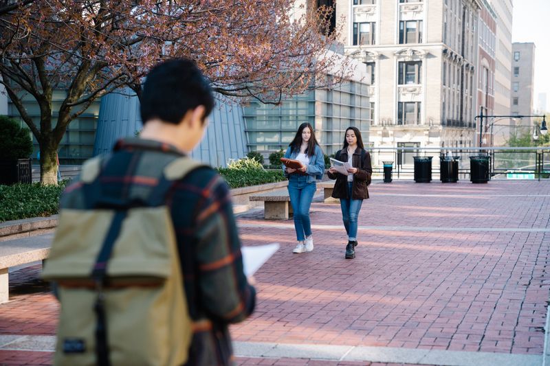 College campus with students walking between classes
