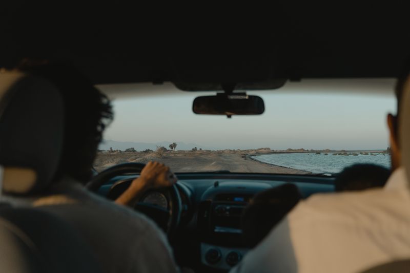 person using laptop comparing insurance