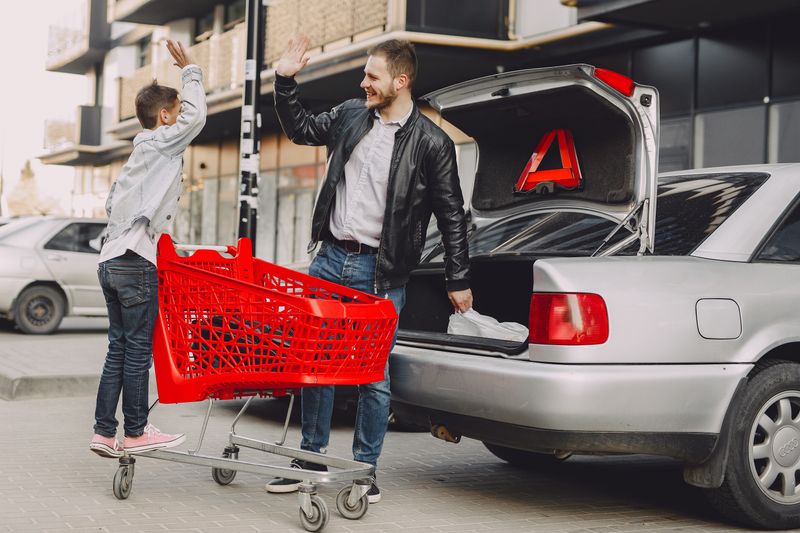 parent and young adult with car keys