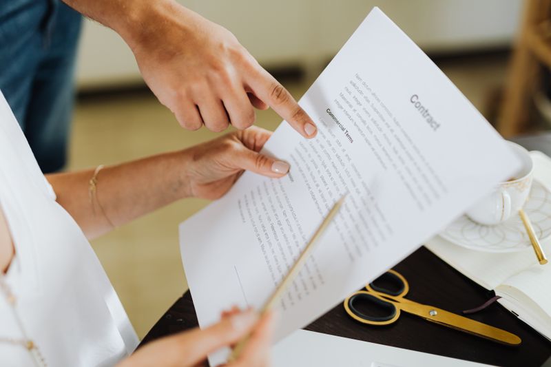 person reading insurance contract carefully