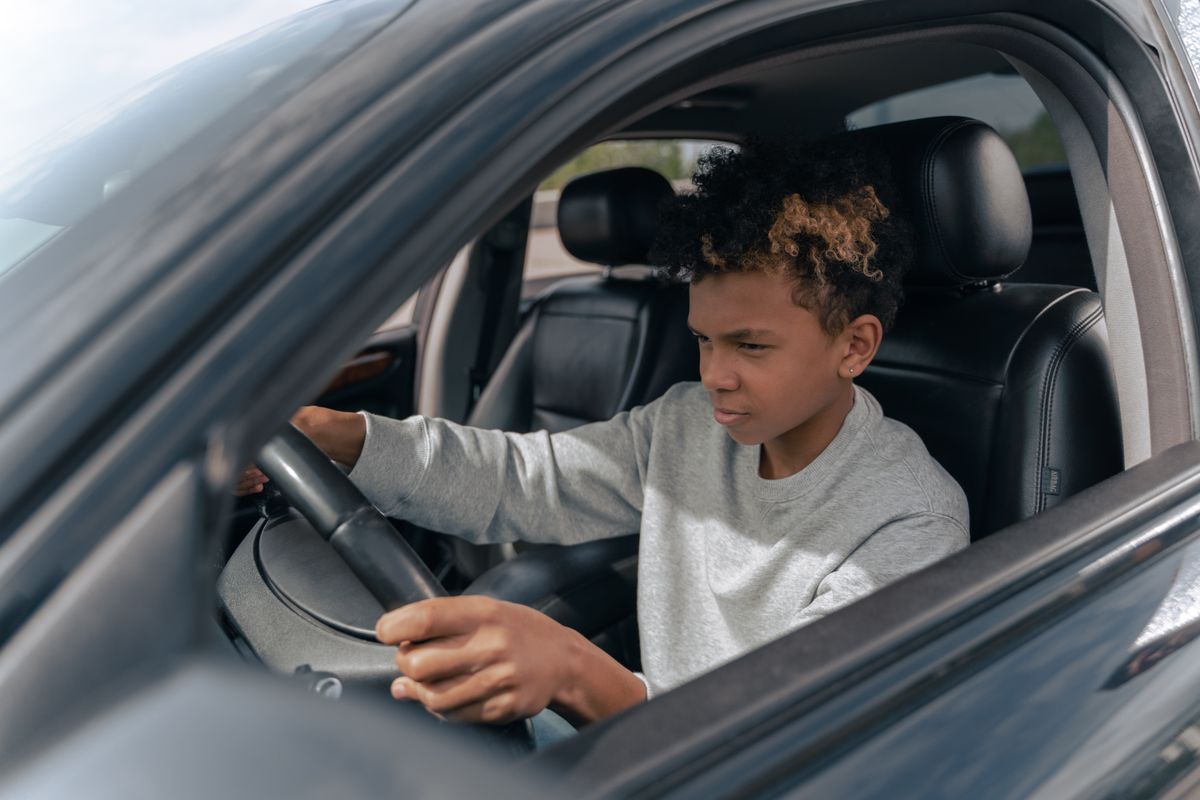Teen driver learning to drive a car - why young drivers pay higher rates