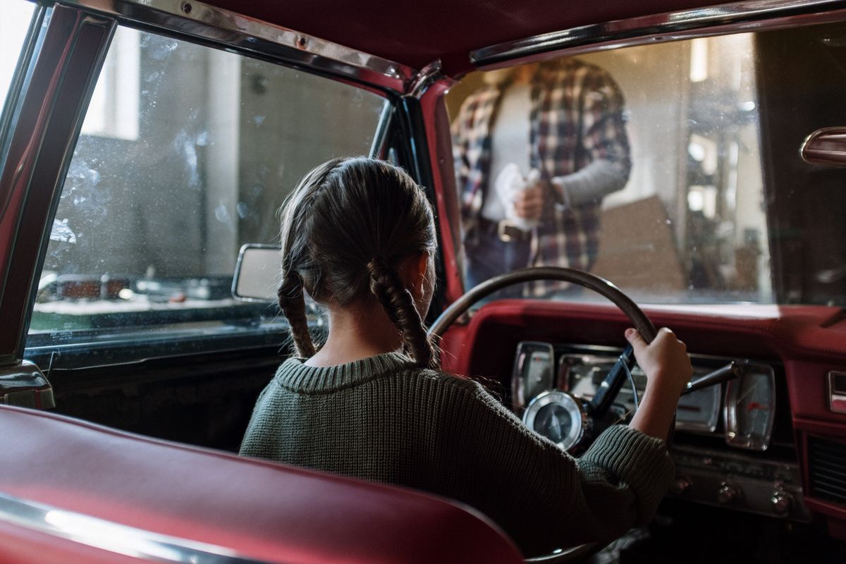 Young person holding car keys
