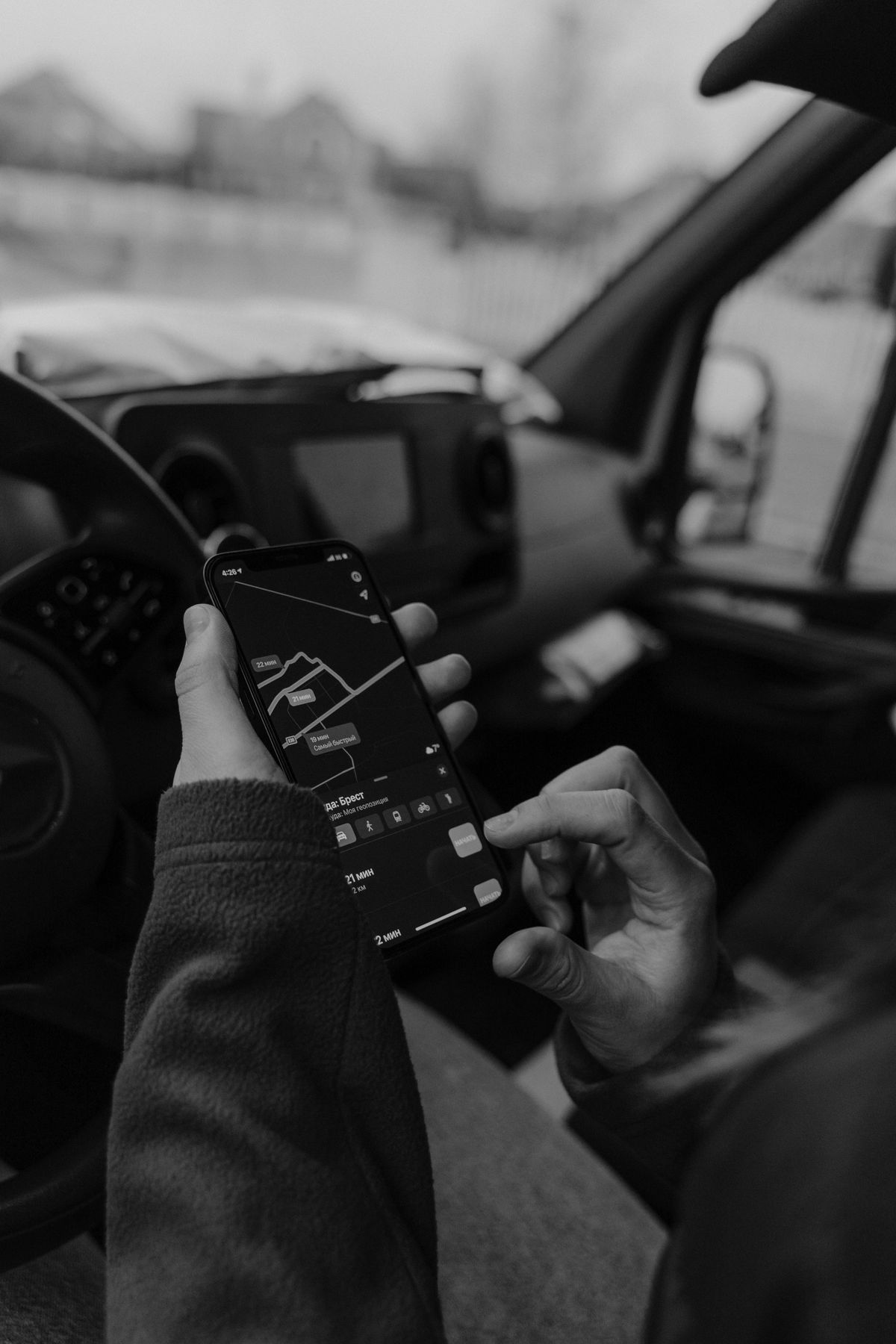 Person using a car insurance app on a smartphone