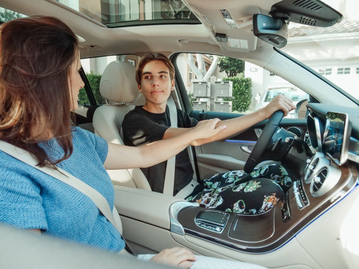 Teen taking a driving lesson