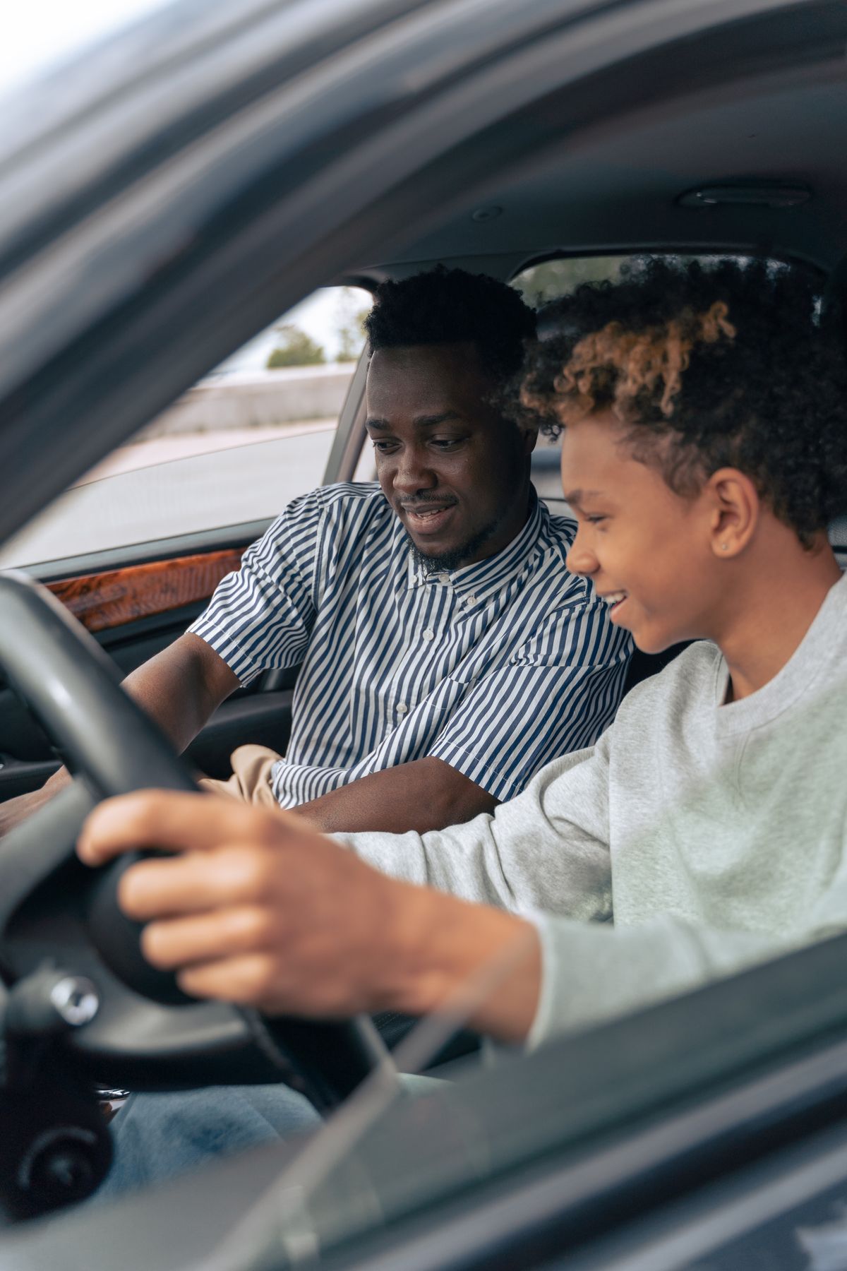 Young driver holding car keys
