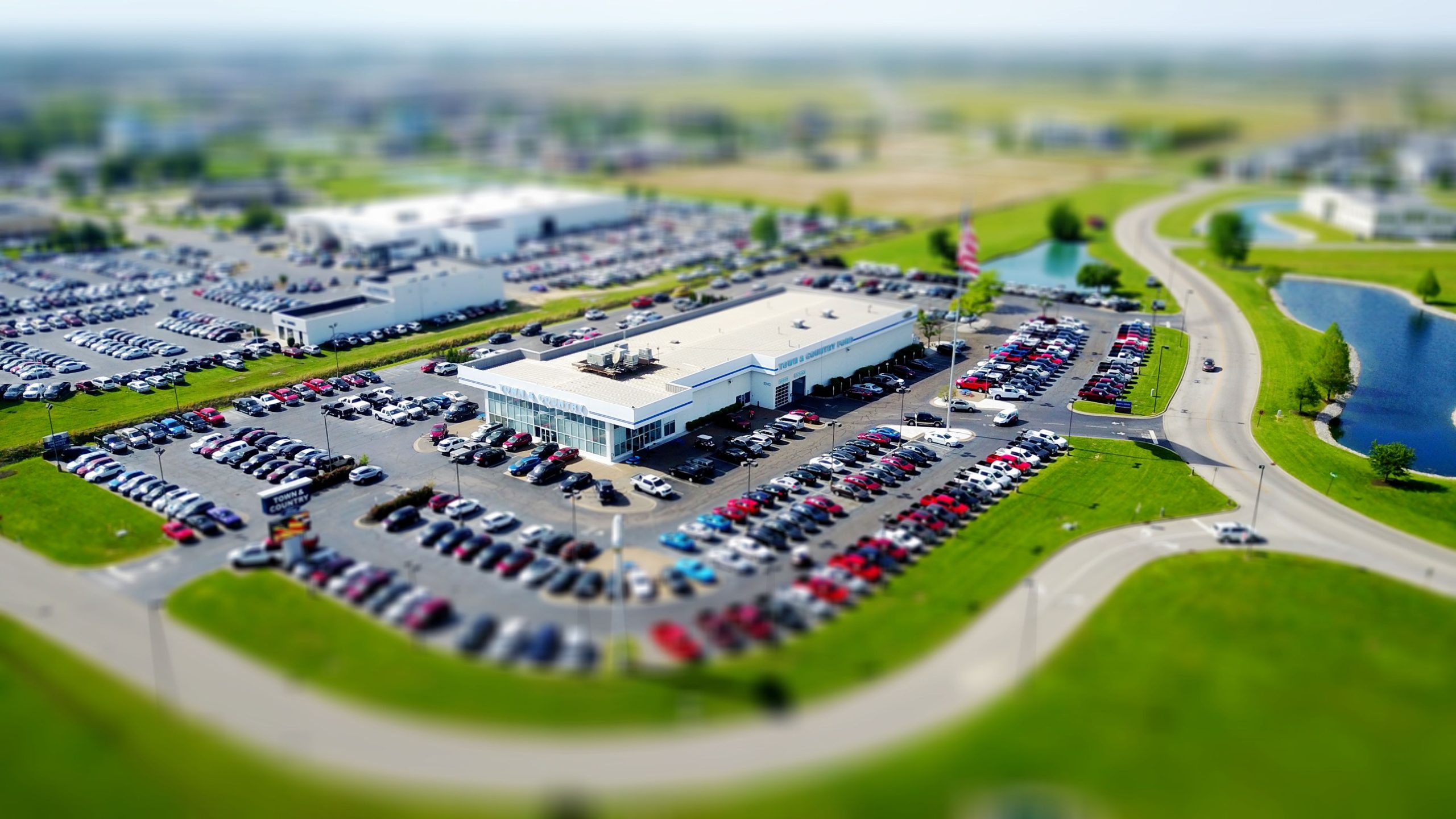 Car dealership lot — buying your first car in the U.S.