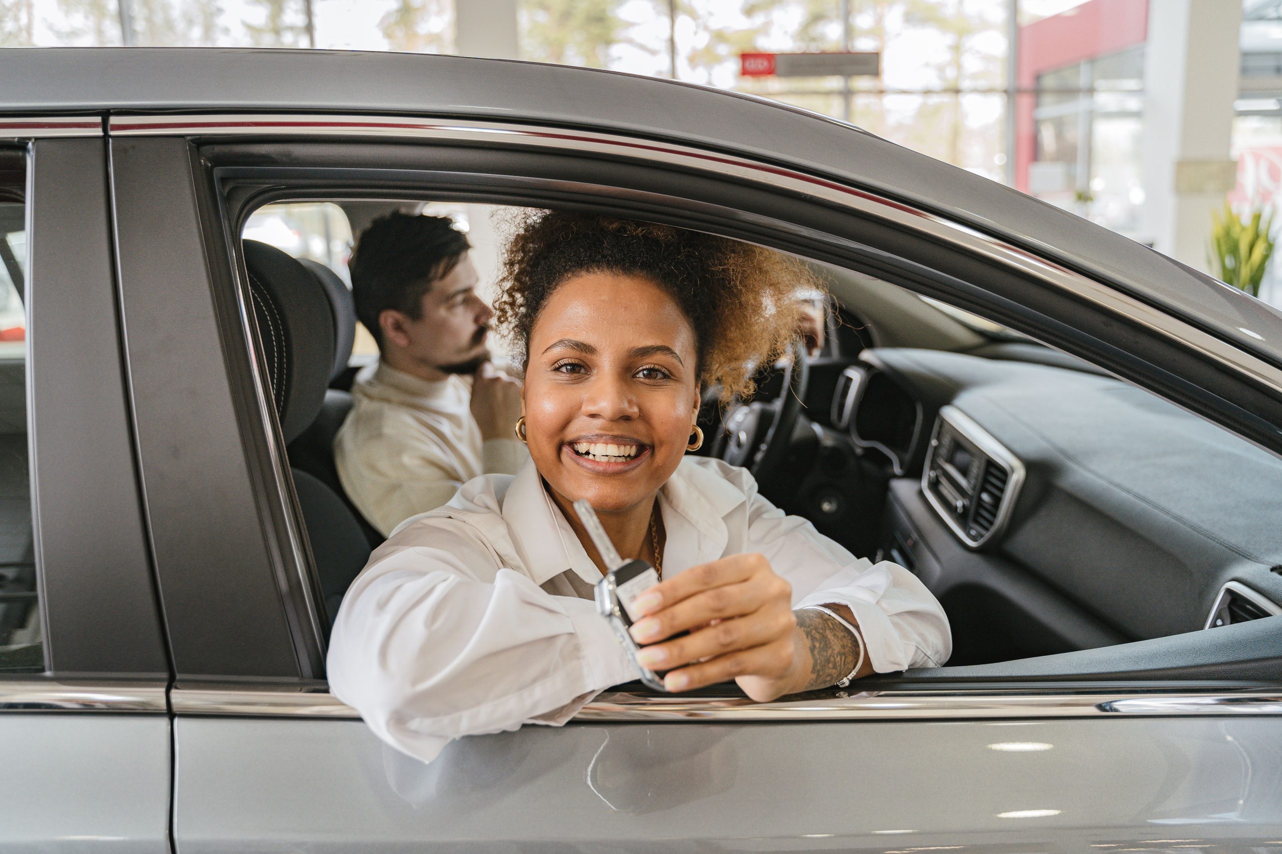 Young driver with car keys