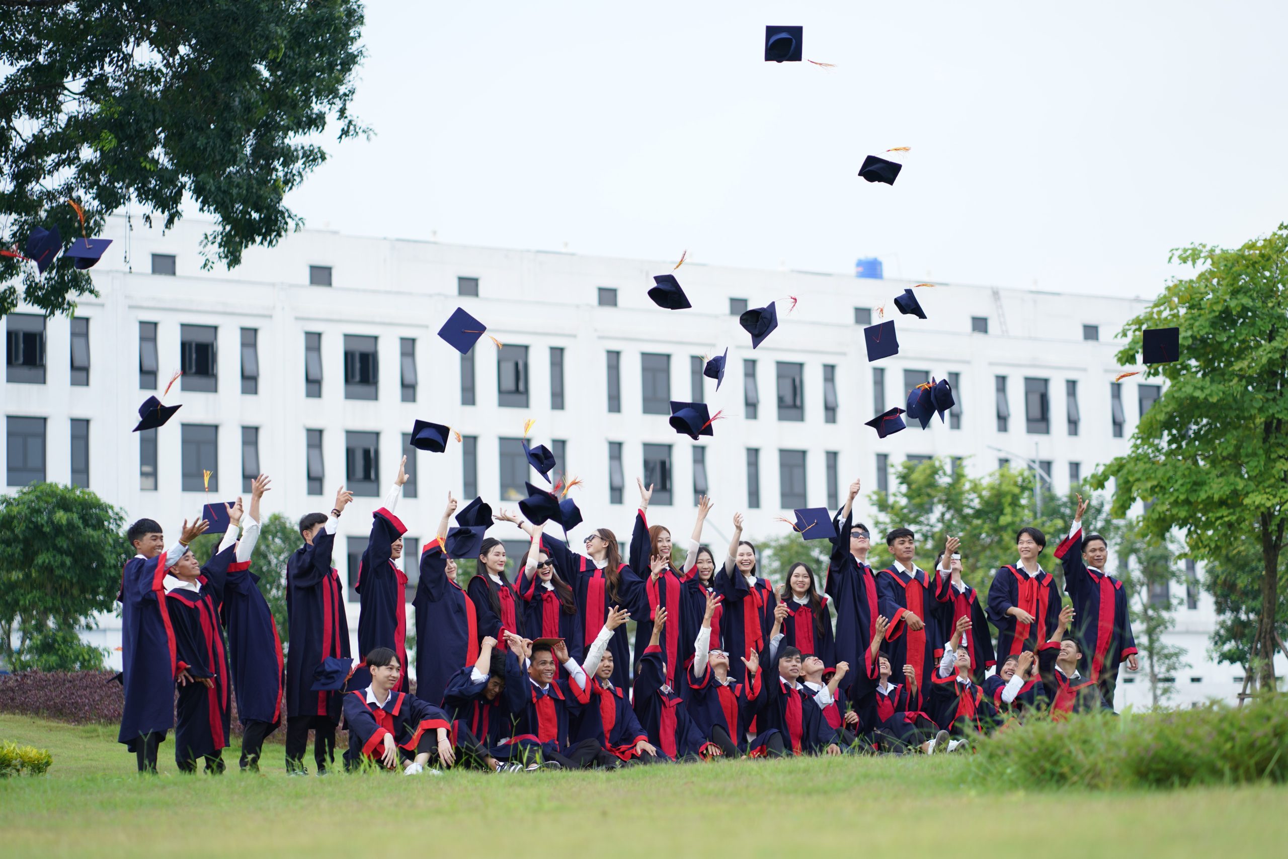 Graduate holding diploma
