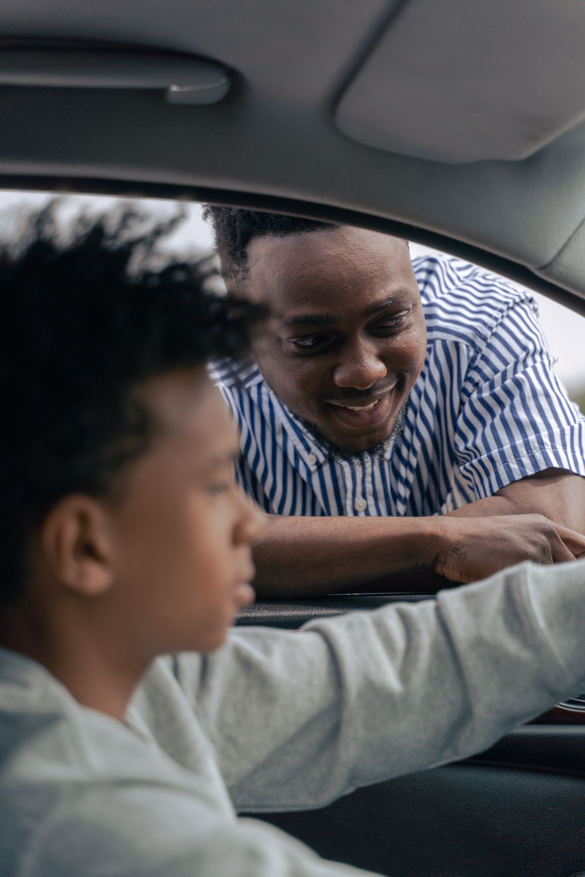 Teen driver with learner's permit behind the wheel