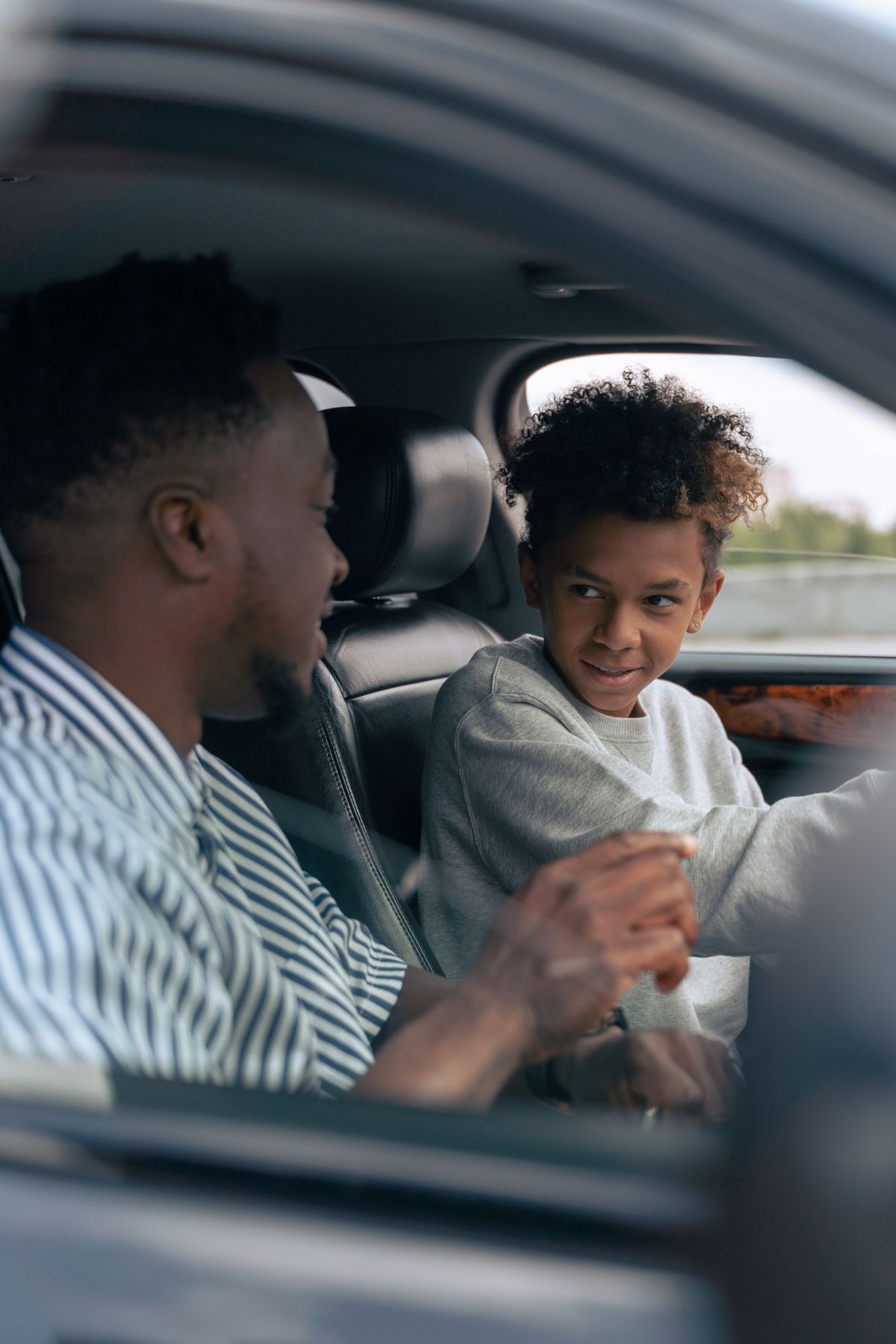 Young driver practicing in a family sedan